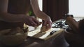 Woman hands cutting bread loaf with knife on home kitchen Royalty Free Stock Photo