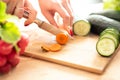Woman hands cutting fresh veg with knife on cutting board Royalty Free Stock Photo