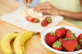 Woman, hands and cutting fruit in kitchen for diet, healthy meal or preparing salad or smoothie at home. Closeup of Royalty Free Stock Photo