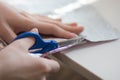 woman hands cutting paper material with scissors Royalty Free Stock Photo