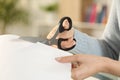 Woman hands cutting paper with scissors at home Royalty Free Stock Photo