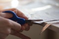 woman hands cutting paper material with scissors Royalty Free Stock Photo