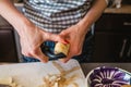 Woman hands cutting potatoes and cooking vegetables salad in kitchen Royalty Free Stock Photo