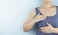 Woman hands doing breast self-exam for checking lumps and signs of breast cancer on white background. Health care and medical Royalty Free Stock Photo