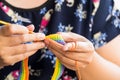 Woman Hands Doing a Rainbow Crochet strap. Handcraft Hobby Crocheting