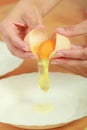 Woman hands with egg in a kitchen Royalty Free Stock Photo