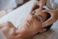 Woman, hands and facial massage for skin care, pamper and beauty therapy for spa treatment. Female person, destress and