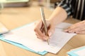 Woman hands filling out application form at home Royalty Free Stock Photo