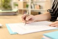 Woman hands filling out form working at home Royalty Free Stock Photo