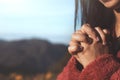 Woman hands folded in prayer in beautiful nature background Royalty Free Stock Photo