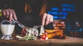 Woman hands with fork and knife eating beef steak