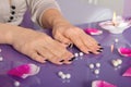 Woman hands with french manicure with crystals Royalty Free Stock Photo