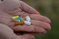 Woman hands full of pills. Royalty Free Stock Photo