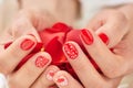 Woman hands full of red petals. Royalty Free Stock Photo