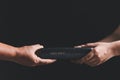 Woman hands giving bible. Mission to spread the gospel and religion of Christianity around the world. hands holding bible on Royalty Free Stock Photo