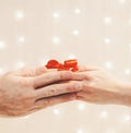 Woman hands giving a gift box to man. Royalty Free Stock Photo
