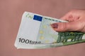 Woman hands giving money like a bribe or tips. Holding EURO banknotes on a blurred background, EU currency Royalty Free Stock Photo