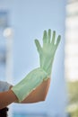 Woman, hands and gloves for cleaning home, hygiene and wellness. Spring cleaning, housekeeper or female cleaner getting Royalty Free Stock Photo