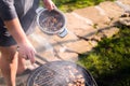 Woman hands grilling barbeque meet on the grill outdoors in the back yard. Summer time picnic. Roasting meat on metal grid on hot Royalty Free Stock Photo