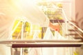 Woman hands hanging her laundry on balcony on the drying rack opposite sea and palm trees view at sunset sunshine. Royalty Free Stock Photo