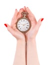 Woman hands holding ancient watch isolated with clipping path