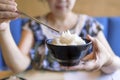 Woman hands holding Bowl of tasty cooked white rice