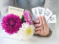 Woman hands holding calendar dates