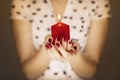 Woman hands holding a candle light Royalty Free Stock Photo