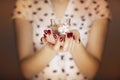 Woman hands holding a candle light Royalty Free Stock Photo