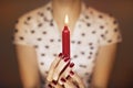 Woman hands holding a candle light Royalty Free Stock Photo