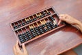 Woman hands holding Chinese ABACUS old antique calculator retro finance education, tool work business accounting Royalty Free Stock Photo