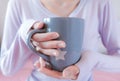 Woman hands holding coffee cup. Girl in sweater holding mug. Morning drink lifestyle. Royalty Free Stock Photo