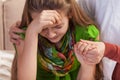 Woman hands holding and consoling crying young girl. Teenage problems concept, close up