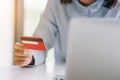 Woman hands holding credit card and using laptop computer.Pays Royalty Free Stock Photo