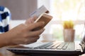 Woman hands holding credit card and using smart phone Royalty Free Stock Photo