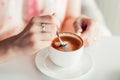 Woman hands holding a cup of coffee