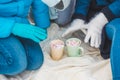 Woman Hands Holding Cup of Hot Chocolate with Marshmallow candies. Knitted mittens and Warm cocoa drink Royalty Free Stock Photo