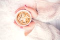 Woman hands holding a cup of hot coffee, espresso on a winter, cold day. View from top Royalty Free Stock Photo