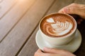 Woman hands holding cup of hot coffee latte cappuccino Royalty Free Stock Photo