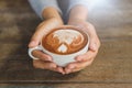 Woman hands holding cup of hot coffee latte cappuccino Royalty Free Stock Photo