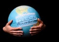 Woman hands holding the Earh globe in the doctor breath medicine mask