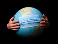 Woman hands holding the Earh globe in the doctor breath medicine mask