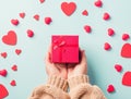 Woman hands holding gift or present box decorated and red heart surprise Royalty Free Stock Photo