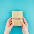 Woman hands holding golden diary Royalty Free Stock Photo