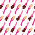 Woman hands holding hair brushes seamless pattern. Royalty Free Stock Photo