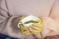 Woman hands holding heart shape cup of coffee Royalty Free Stock Photo