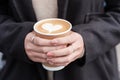 Woman hands holding Hot coffee paper cup, heart shape latte coffee art. Love, holiday, Valentine day and free plastic container Royalty Free Stock Photo