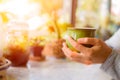 Woman hands holding hot cup of coffee in morning. Royalty Free Stock Photo