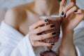 woman hands holding a hot cup of coffee or tea in the morning Royalty Free Stock Photo