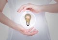 Woman hands holding light bulb with business concept inside Royalty Free Stock Photo